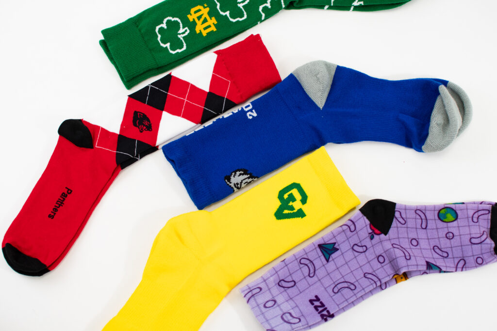 custom socks with college logos make for the best college giveaways